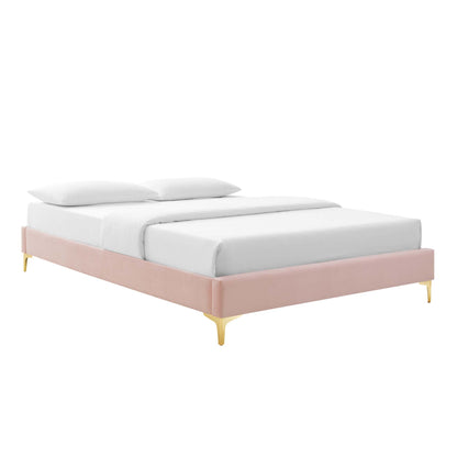 Red velvet upholstered queen bed frame with gold tapered legs and white bedding.