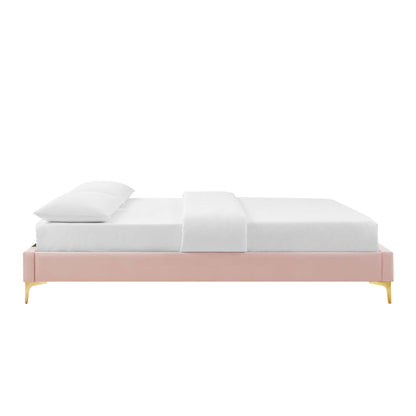 Red platform bed frame with gold legs, white mattress, pillow and blanket, modern minimalist style.