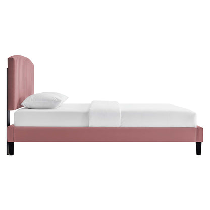 Red upholstered platform bed with tall ribbed headboard, white bedding, and black tapered legs.