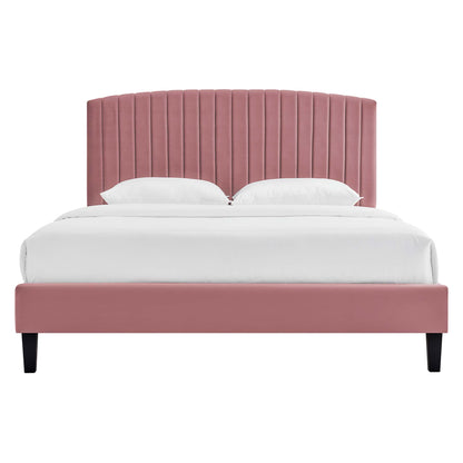 Dusty-rose velvet platform bed with tall vertical-channel tufted headboard and black tapered legs, white bedding.
