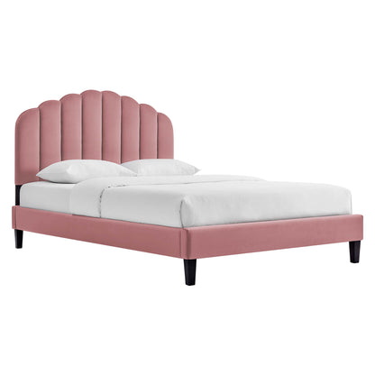 Red velvet upholstered queen platform bed with a scalloped arched headboard, white bedding, and black tapered legs.