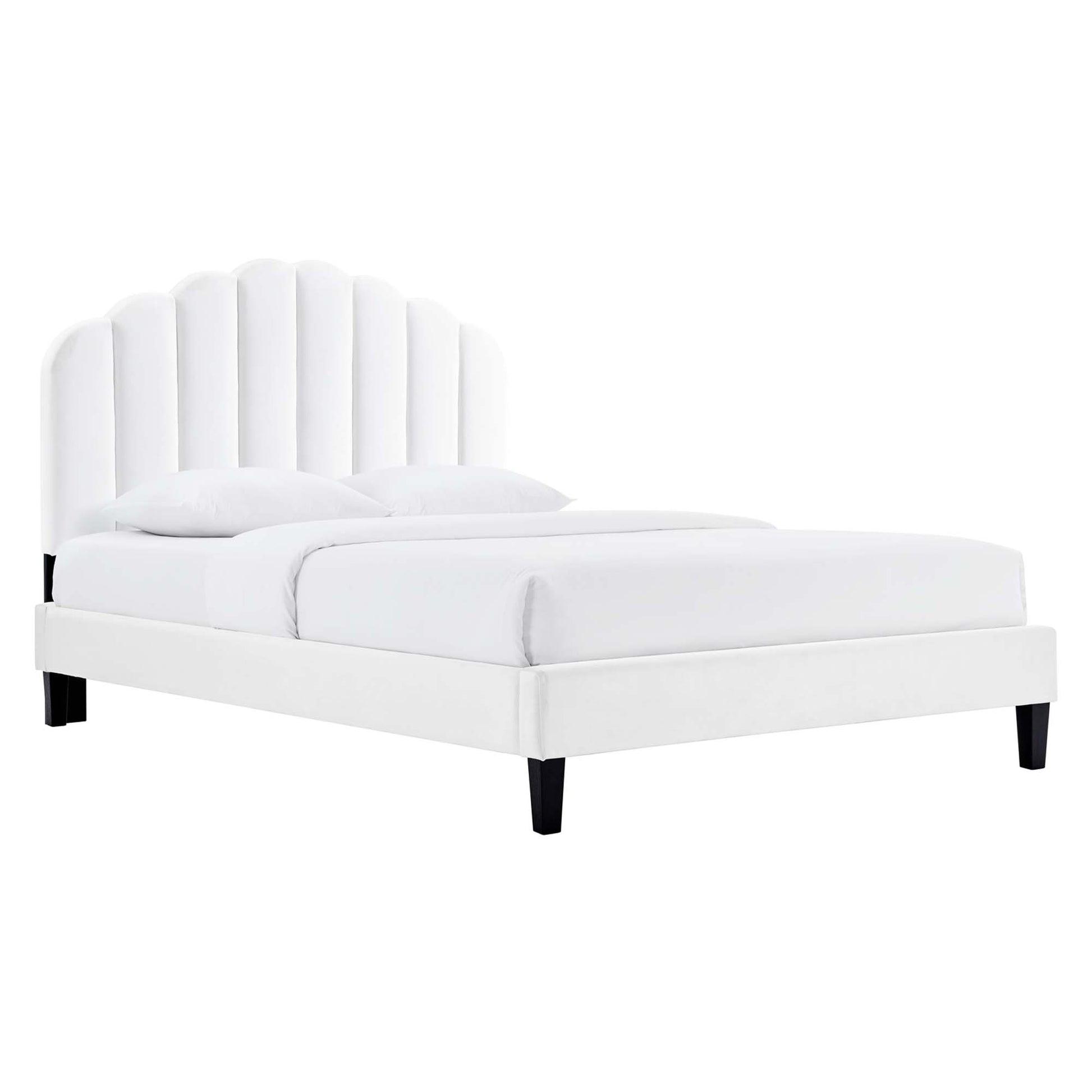 White fabric upholstered platform bed with tall, arched, vertical-panel headboard and black legs.