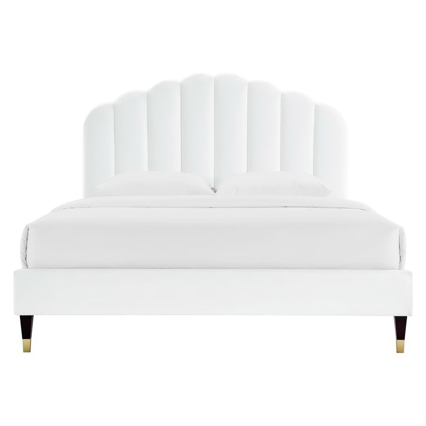 White upholstered platform bed with a tall scalloped shell headboard and gold-tipped legs.