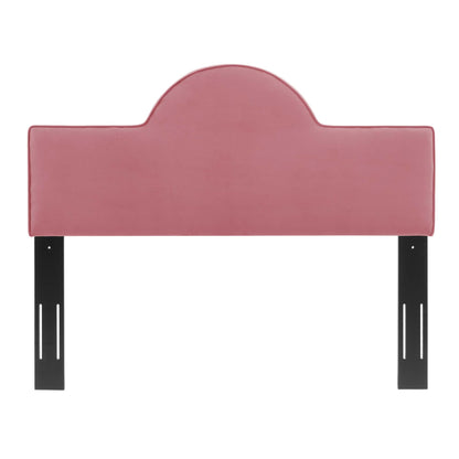 Dusty rose upholstered headboard with a rounded central arch and black metal legs.