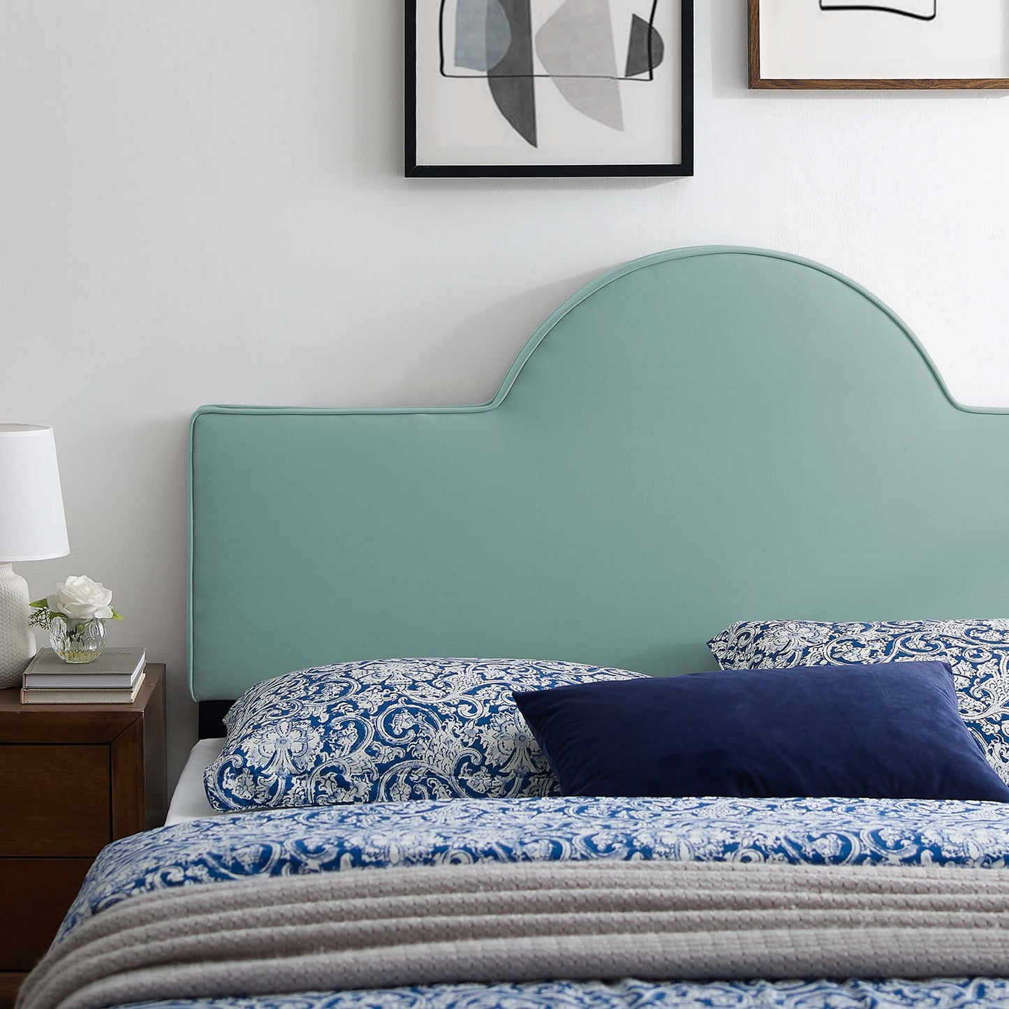 Mint green curved upholstered twin headboard.
