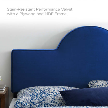 Stain-resistant navy velvet headboard with a scalloped curved top, MDF/plywood frame, paired with blue damask bedding.