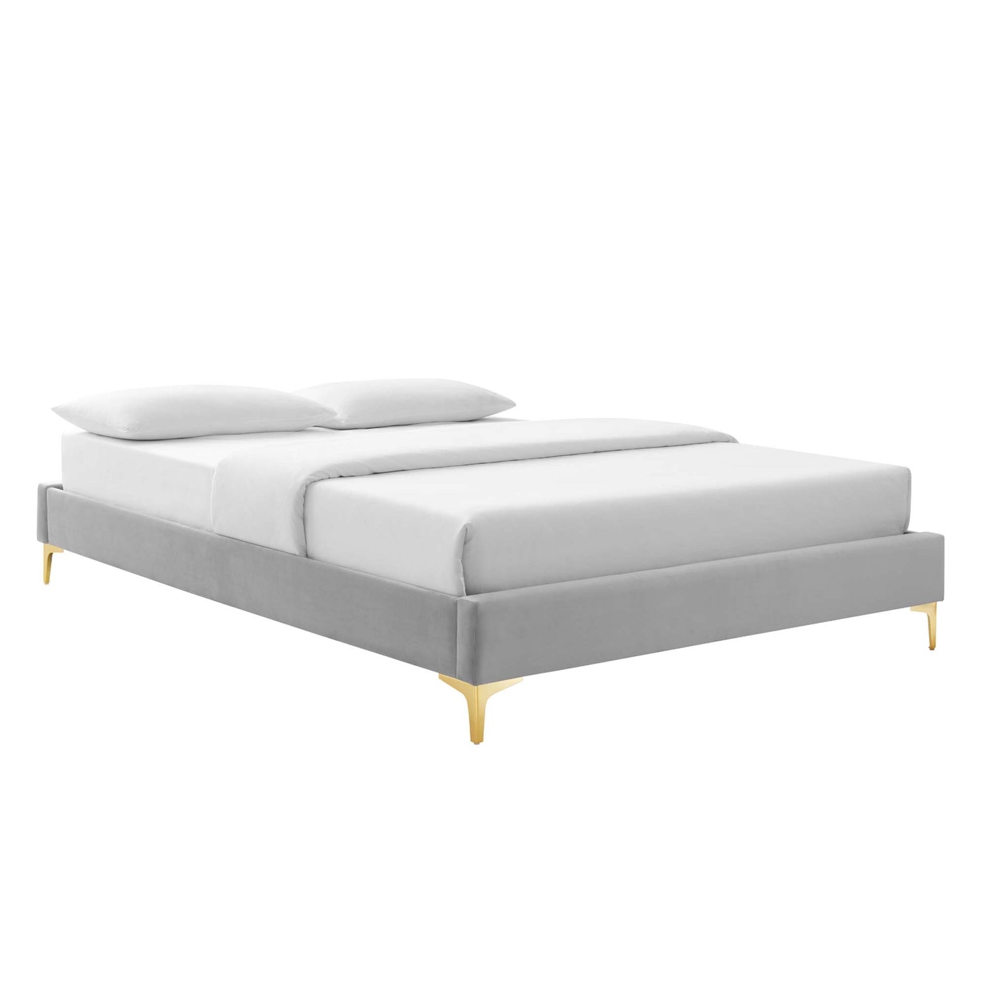 Light gray upholstered platform bed with low profile frame, white bedding, two pillows & gold tapered legs.