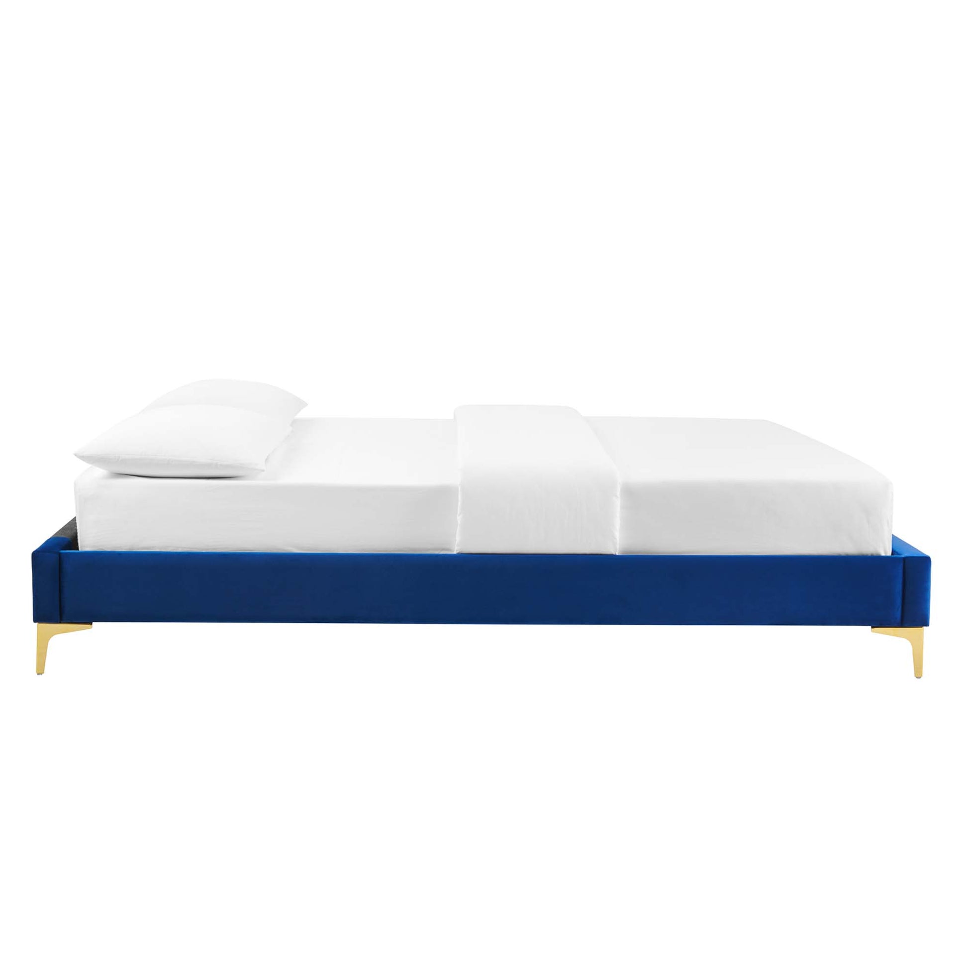 Navy blue low-profile platform bed with gold legs, white sheets and two pillows.