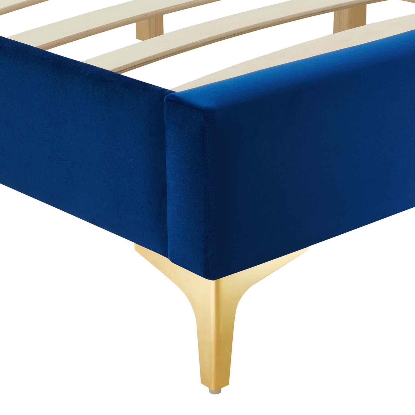 Navy blue velvet upholstered full bed frame with gold tapered metal legs and light wood slat support.