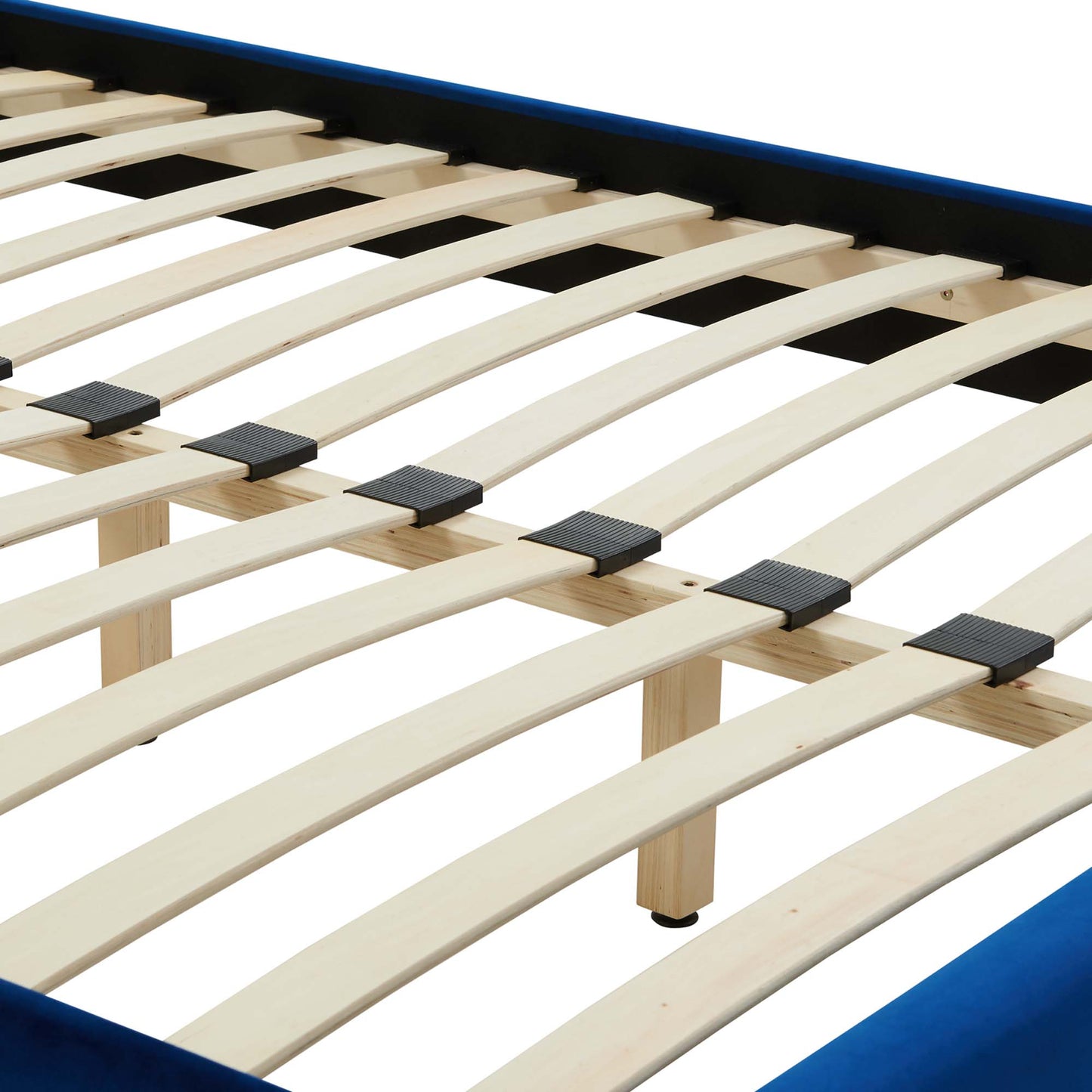Light wood curved slats on a navy blue bed frame with black plastic connectors for mattress support.