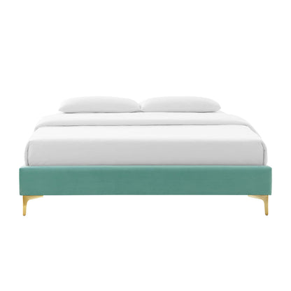 Mint performance velvet king bed frame with gold legs and white bedding.
