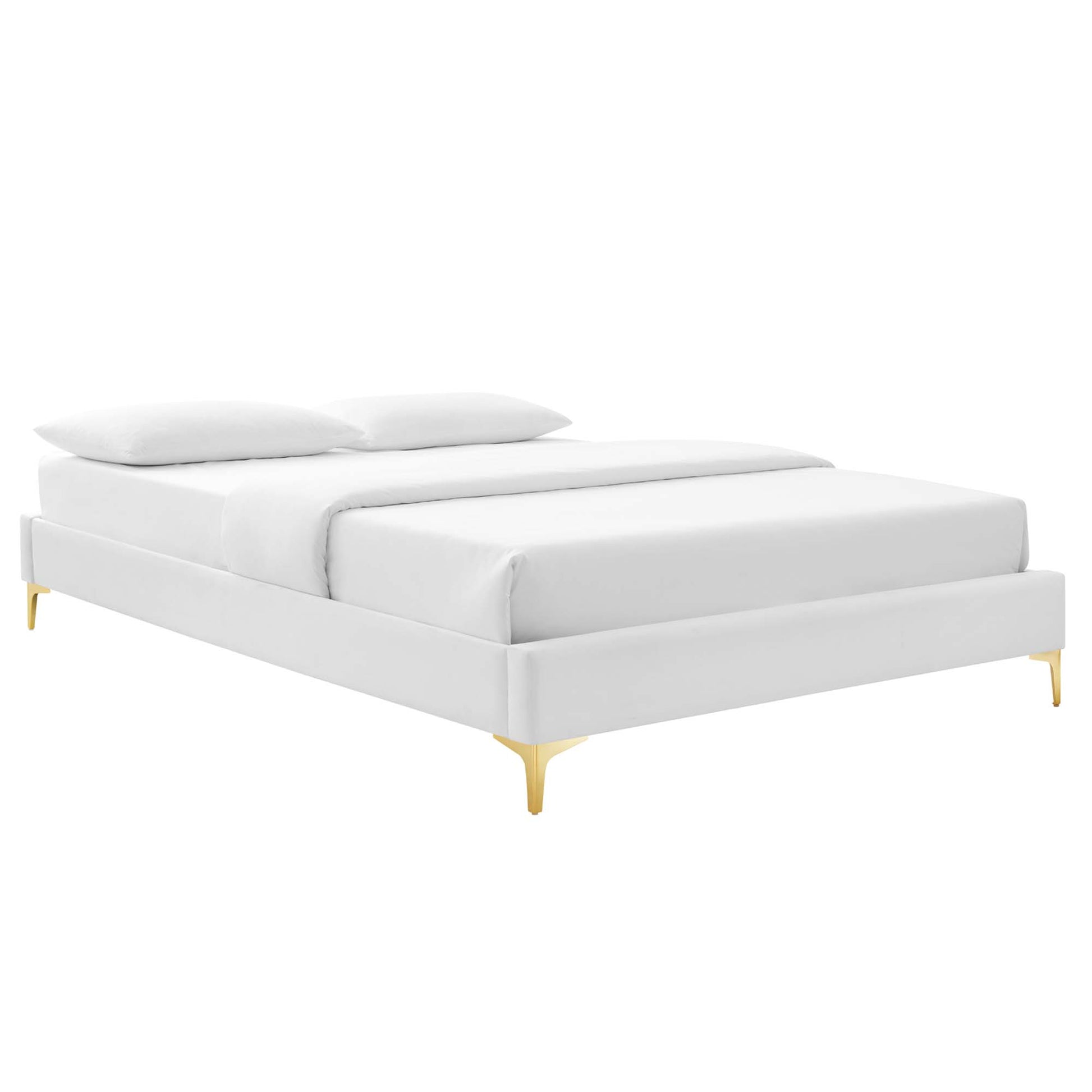 White upholstered platform bed with gold legs, minimalist mid-century modern style, with two pillows.