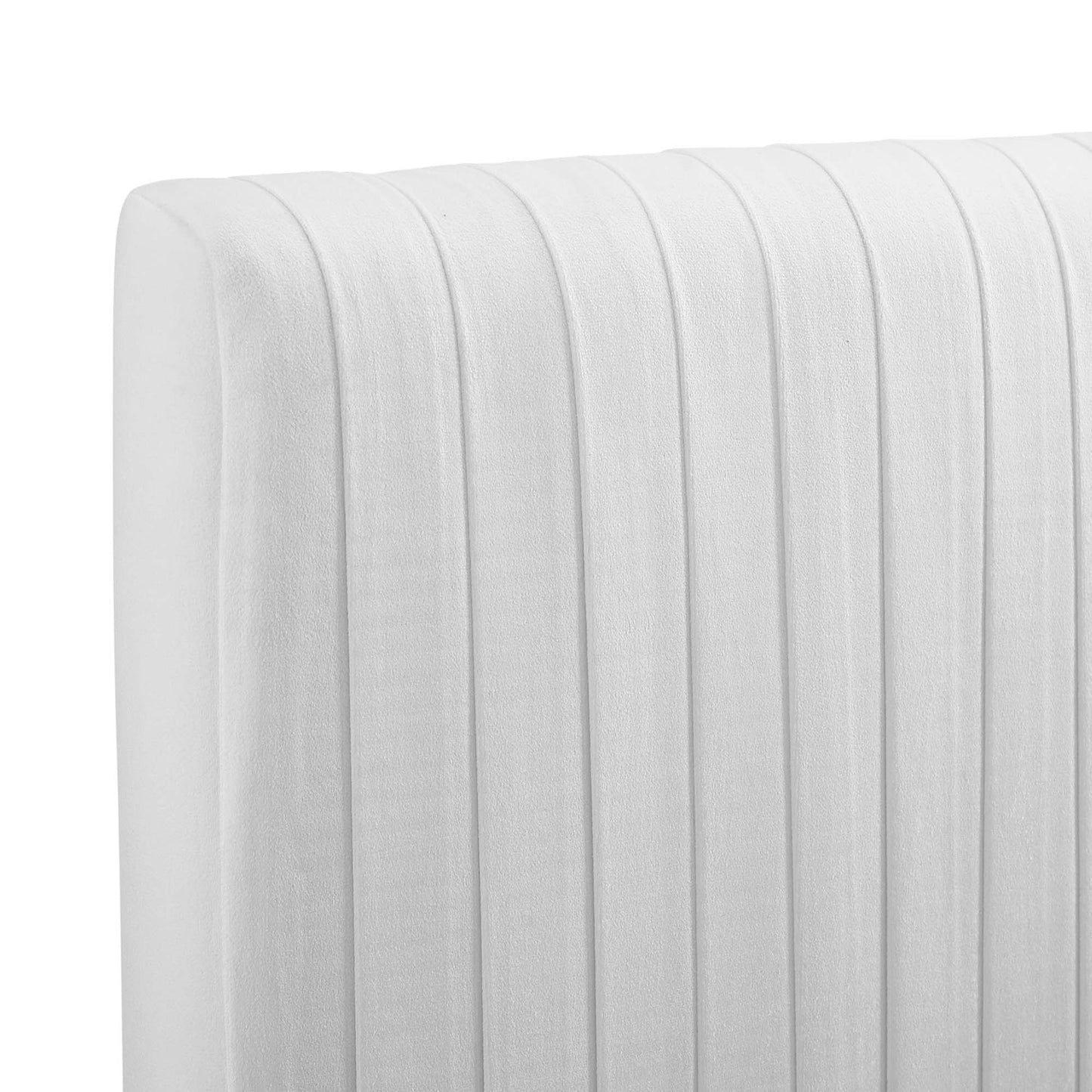 White fabric upholstered headboard with vertical channel tufting and rounded edge.