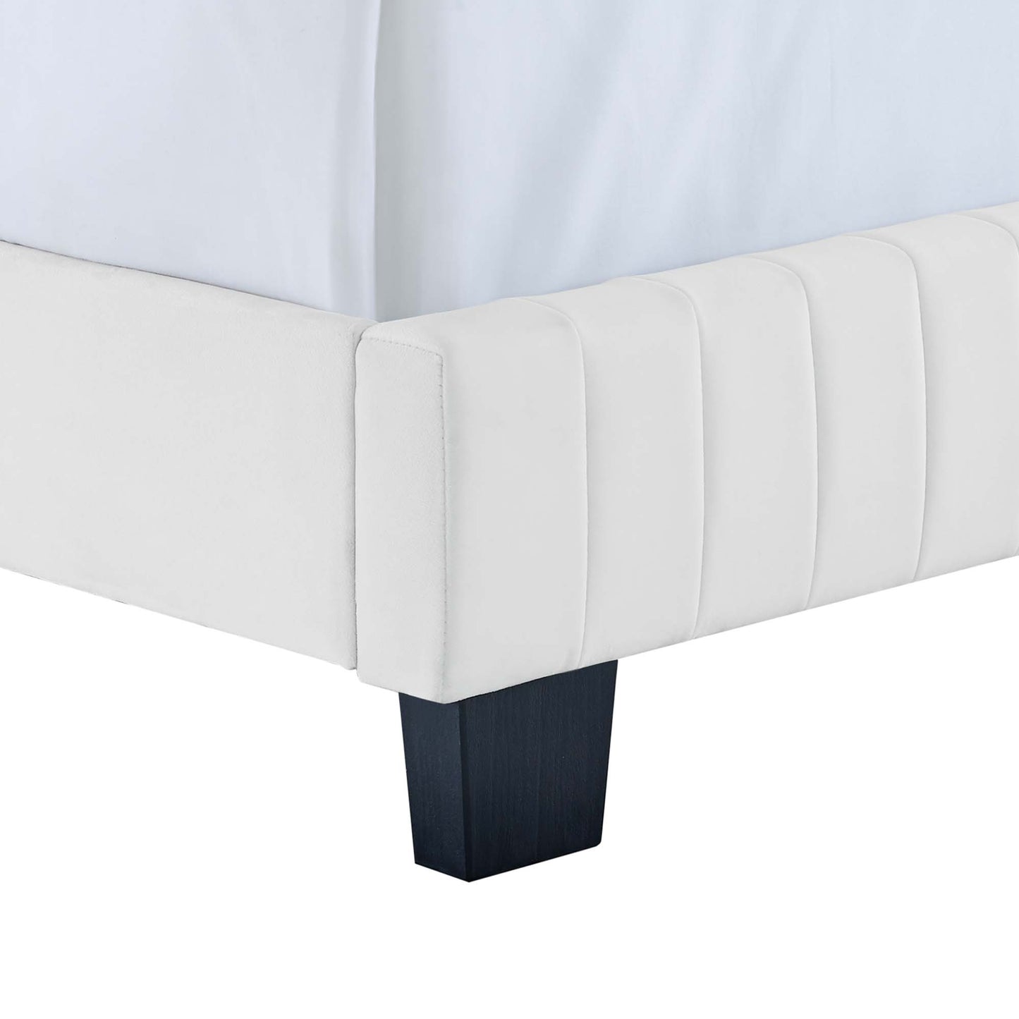 White king bed with channel-tufted headboard in performance velvet, dark square wood legs.