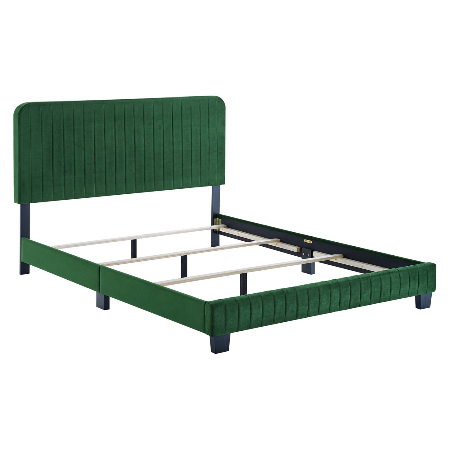 Green velvet upholstered platform bed with tall tufted headboard, dark blue legs, and wooden slat support.