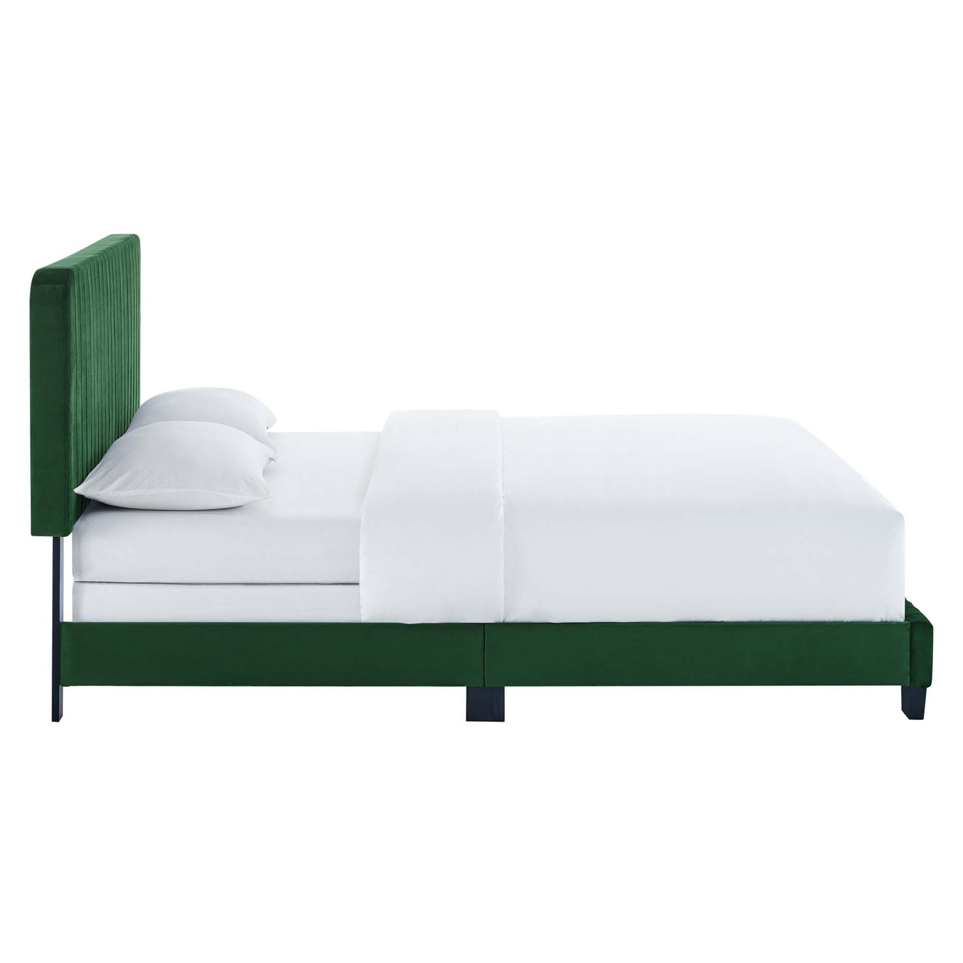 Green velvet upholstered bed with a tall tufted channel headboard, white linens and two pillows, dark legs, modern luxury style.