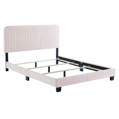 Blush pink upholstered queen bed frame with vertical channel tufting on headboard and footboard, dark legs, wooden slats.