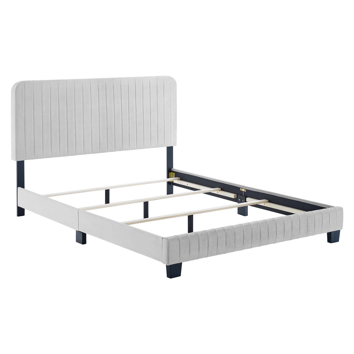 Light gray upholstered full bed with vertical-channel headboard, navy legs, and wooden slat support.