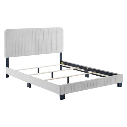 Light gray upholstered full bed with vertical-channel headboard, navy legs, and wooden slat support.