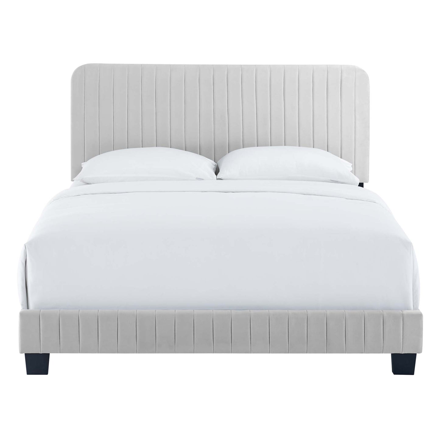 Light gray upholstered bed with vertical-channel headboard and footboard, white linens and dark legs.