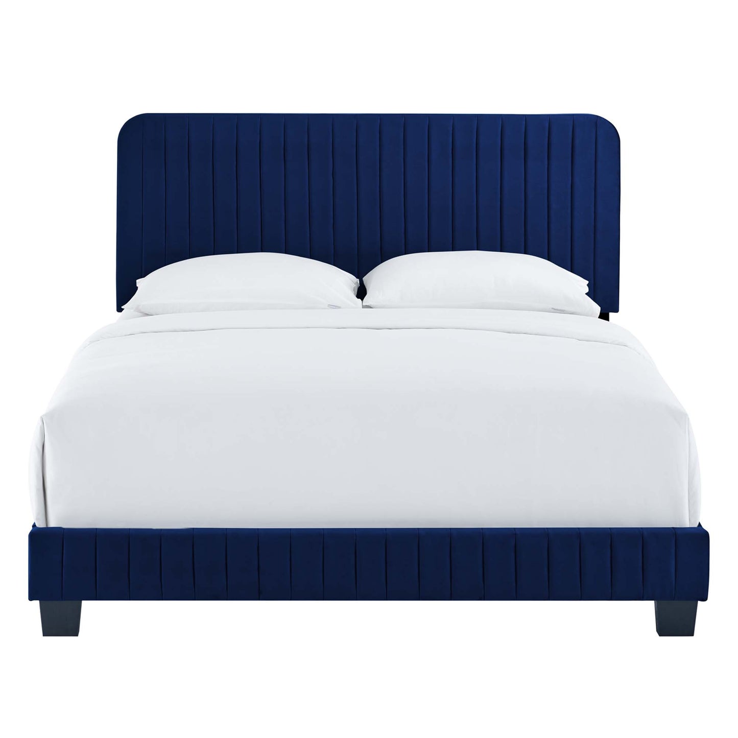 Navy blue upholstered bed with tall vertical-channel headboard and matching footboard, white bedding.