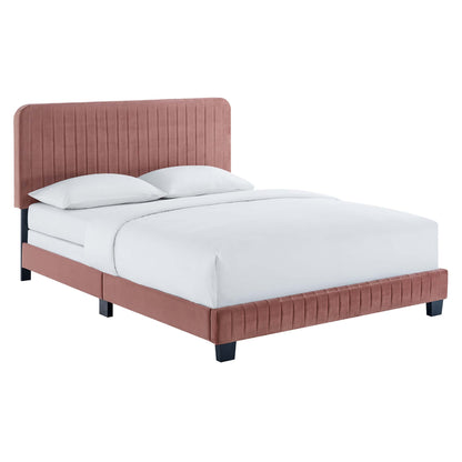 Red velvet twin bed with tall channel-tufted headboard, low footboard, black legs, & white linen bedding.