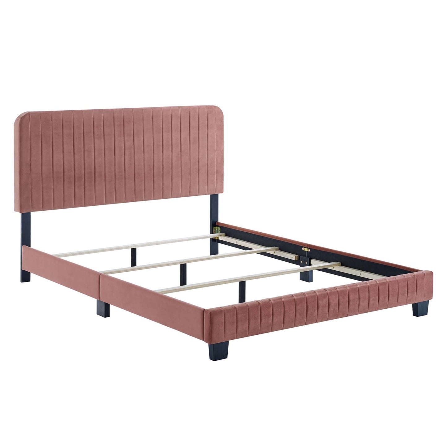 Red velvet upholstered twin bed with vertical channel tufting, dark blue legs and wooden slat support.