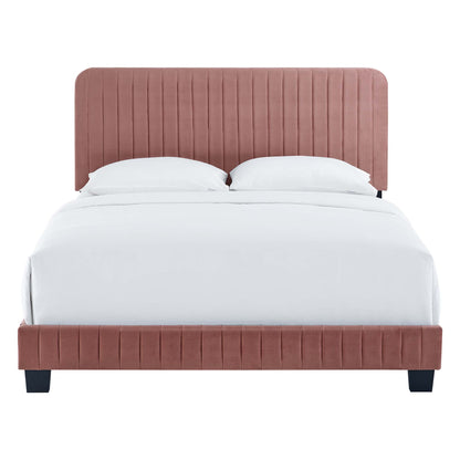 Dusty rose velvet upholstered bed with tall, channel-tufted headboard and low footboard, white bedding.