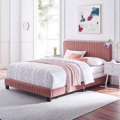 Red velvet twin bed with tufted headboard, white quilted bedding, blush throw, white nightstand, gold lamp, abstract wall art.