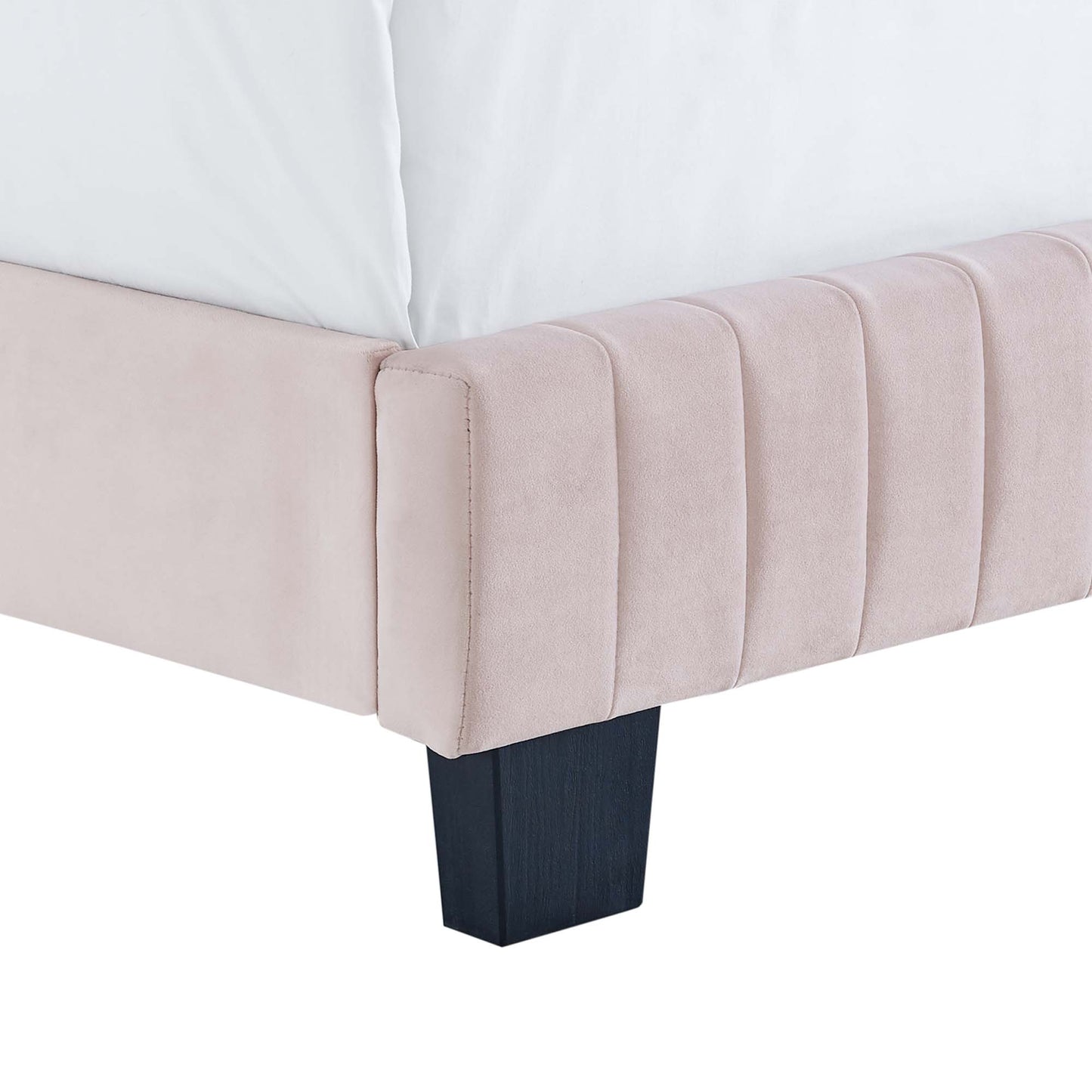 Red velvet twin bed with vertical channel tufting on the headboard and dark square wood legs.