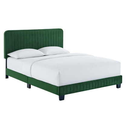 Green upholstered bed with tall channel-tufted headboard and footboard, black legs, white sheets.