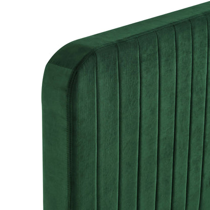 Emerald green velvet king platform bed with a vertical channel-tufted headboard.