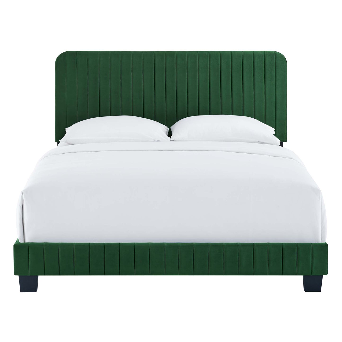 Emerald green velvet upholstered bed with tall vertical-channel headboard and matching footboard, white linens.