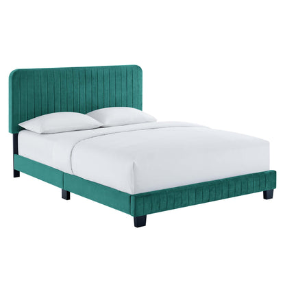 Teal velvet upholstered bed with tall vertical channel-tufted headboard and matching footboard, white bedding.