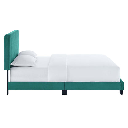 Teal velvet platform bed with tall upholstered headboard, white bedding, modern minimalist design.