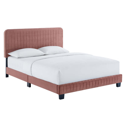 Dusty rose upholstered bed with vertical channel-tufted headboard & footboard, white linens, black legs.