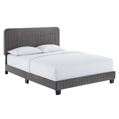 Gray upholstered platform bed with a tall vertical-channel headboard and matching footboard, white bedding.