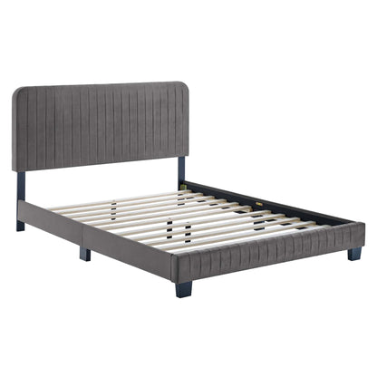 Grey upholstered platform bed with tall tufted headboard, padded footboard, wooden slat support & dark legs.