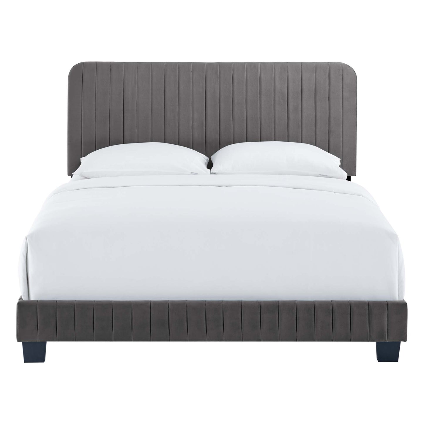 Grey upholstered platform bed with vertical channel tufting on headboard and footboard, white bedding, short dark legs.