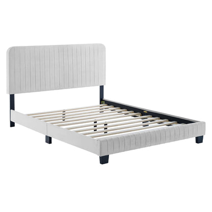 Light gray upholstered full platform bed with vertical channel-tufted headboard and footboard, slatted base, dark legs.