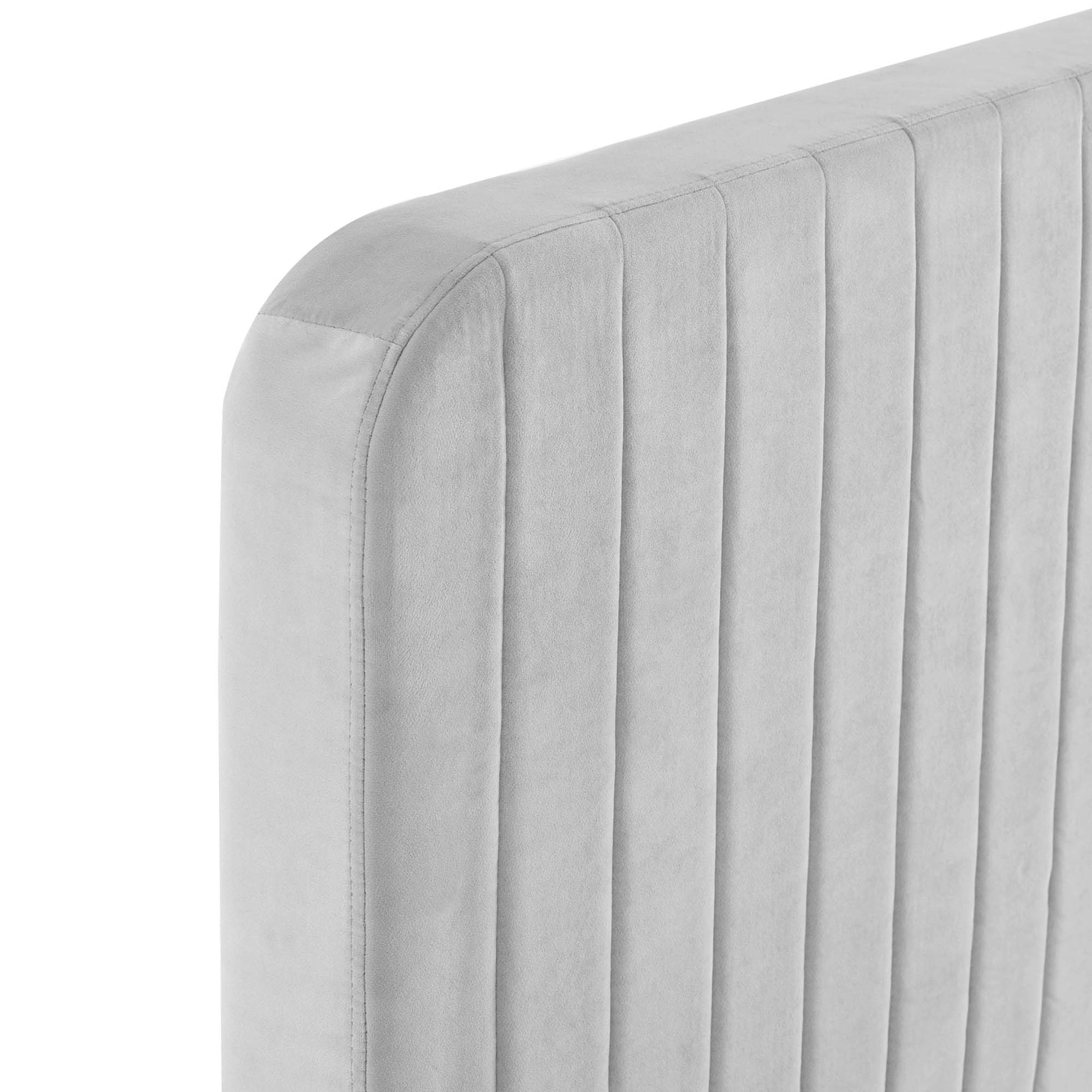 Light gray velvet-like upholstered full platform bed with a channel-tufted headboard and rounded corners.