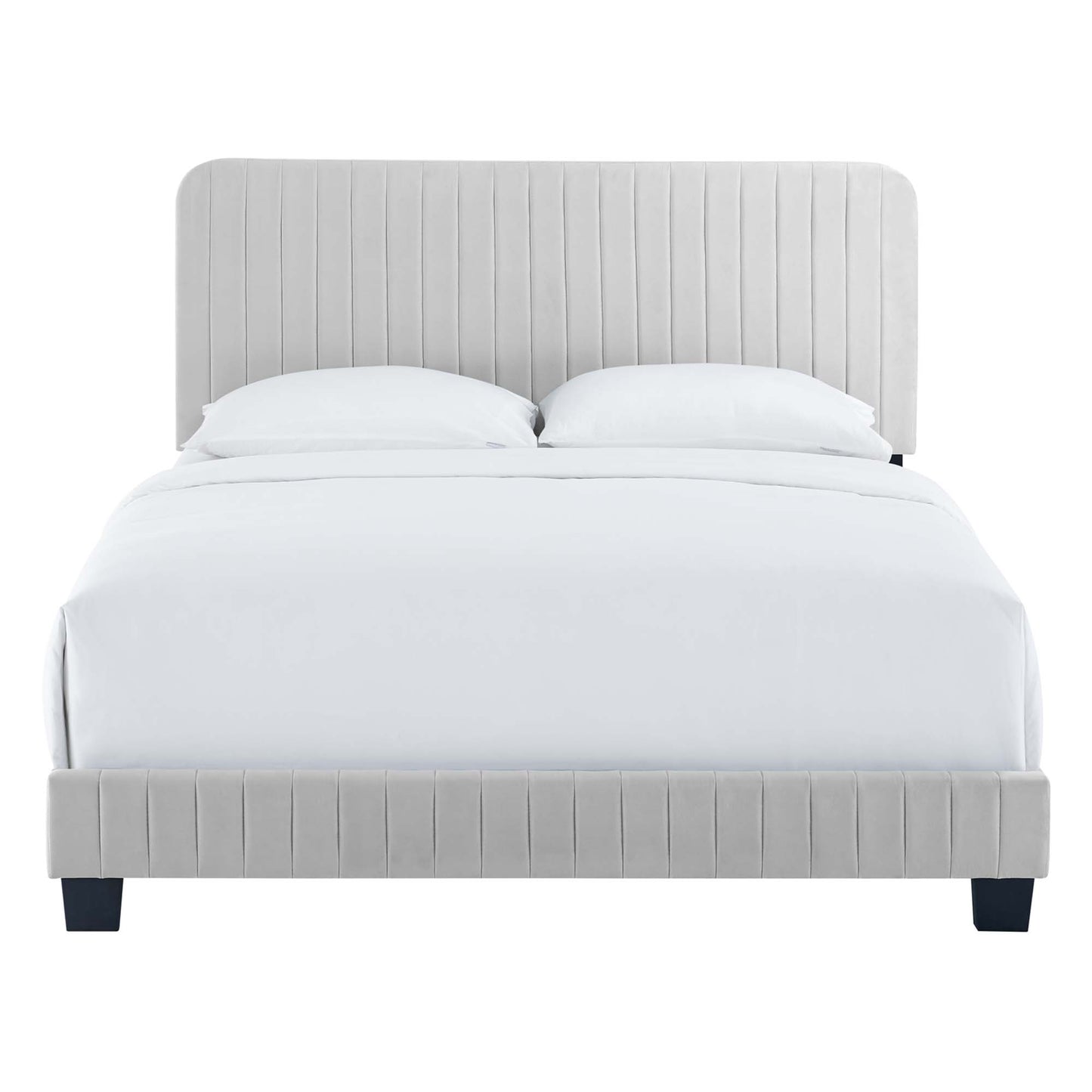 Grey upholstered platform bed with tall channel-tufted headboard and matching footboard, white bedding.