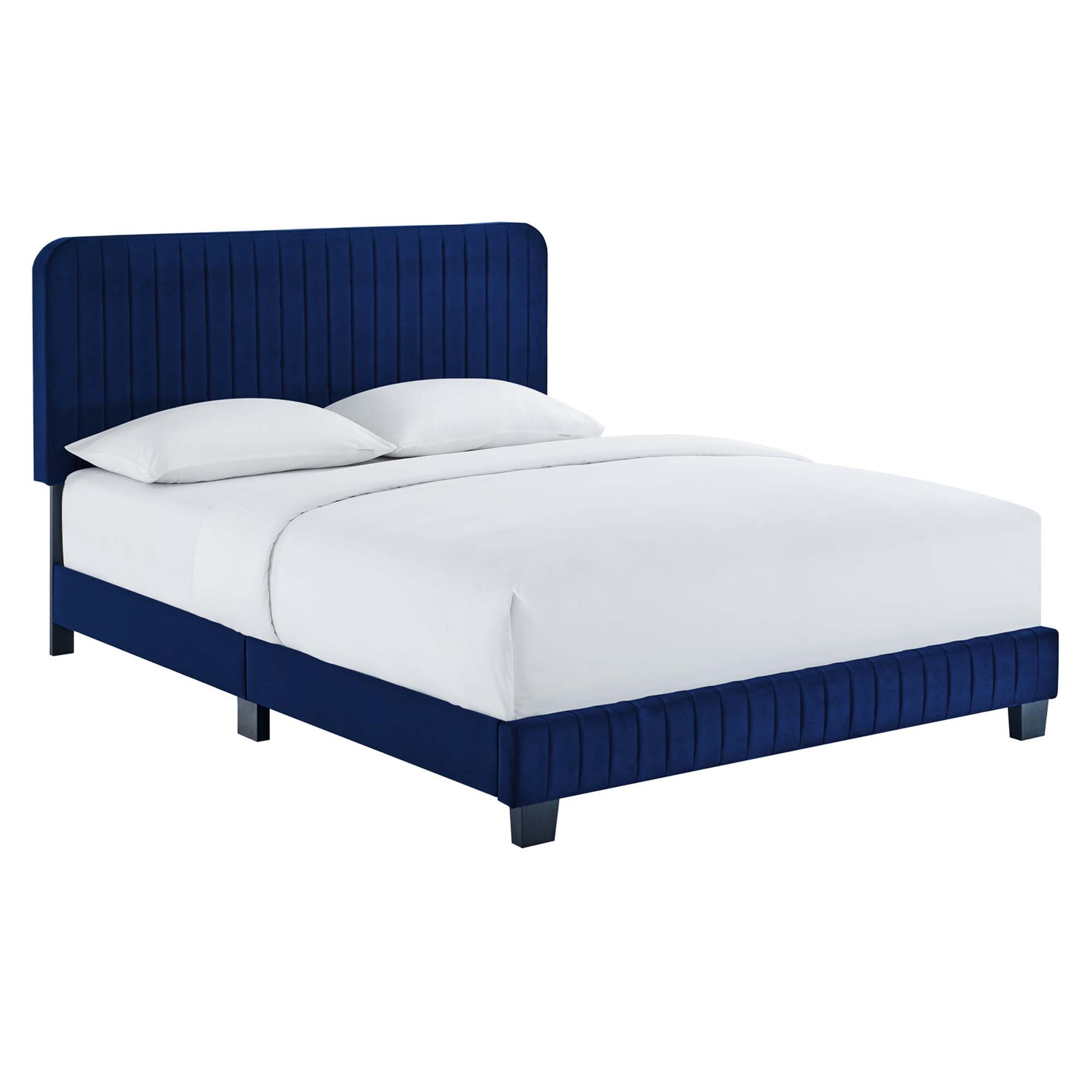 Navy blue velvet platform bed with tall tufted headboard and matching footboard, white sheets and pillows.