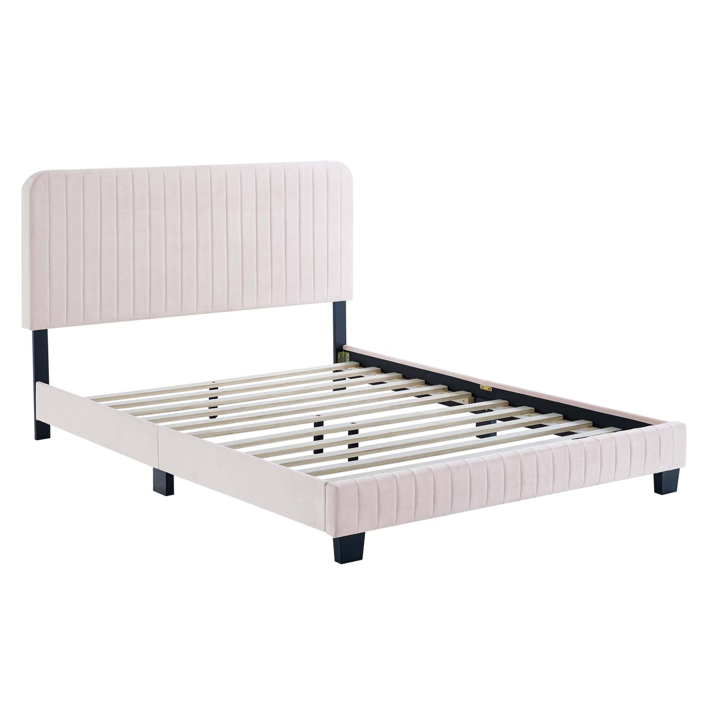 Blush pink upholstered bed frame with vertical channel-tufted headboard and footboard, black legs, slatted base.