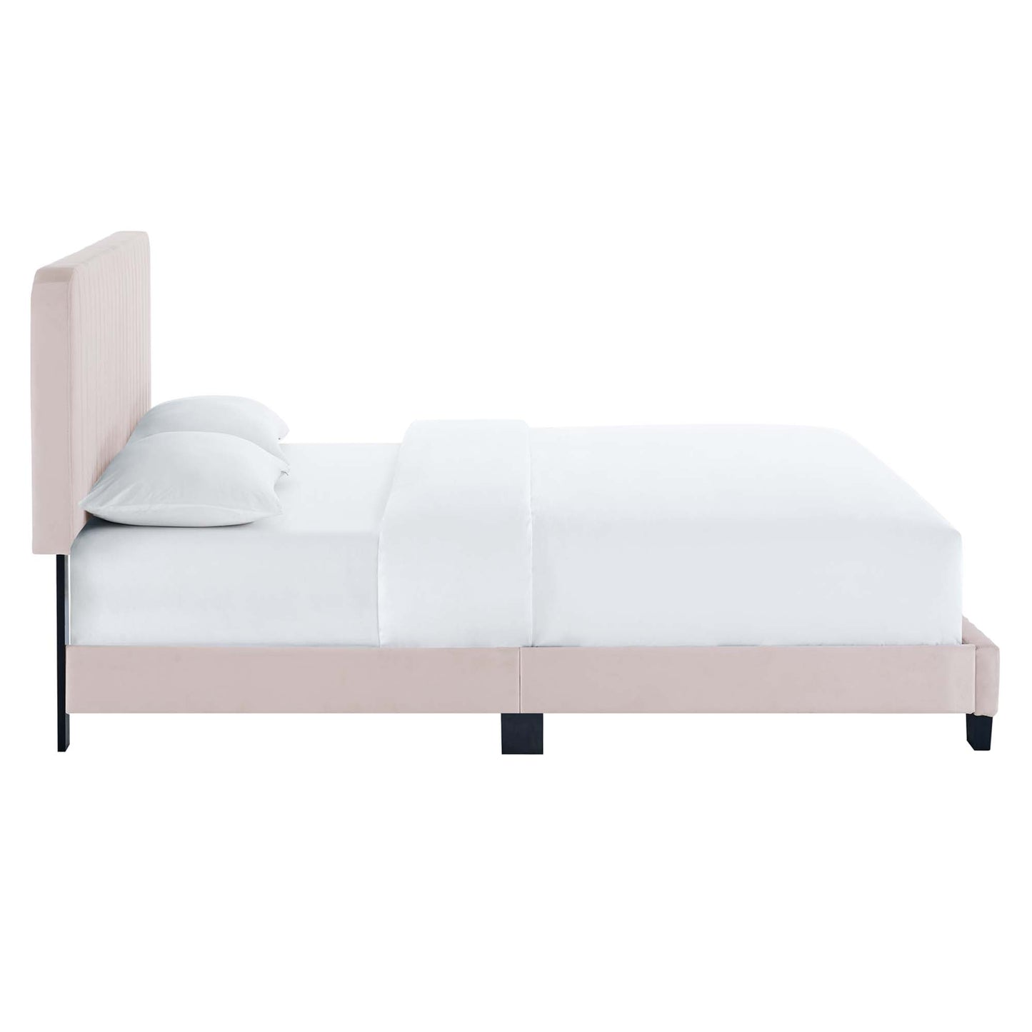 Soft pink upholstered platform bed with a tall padded headboard, white bedding and pillows, black legs.
