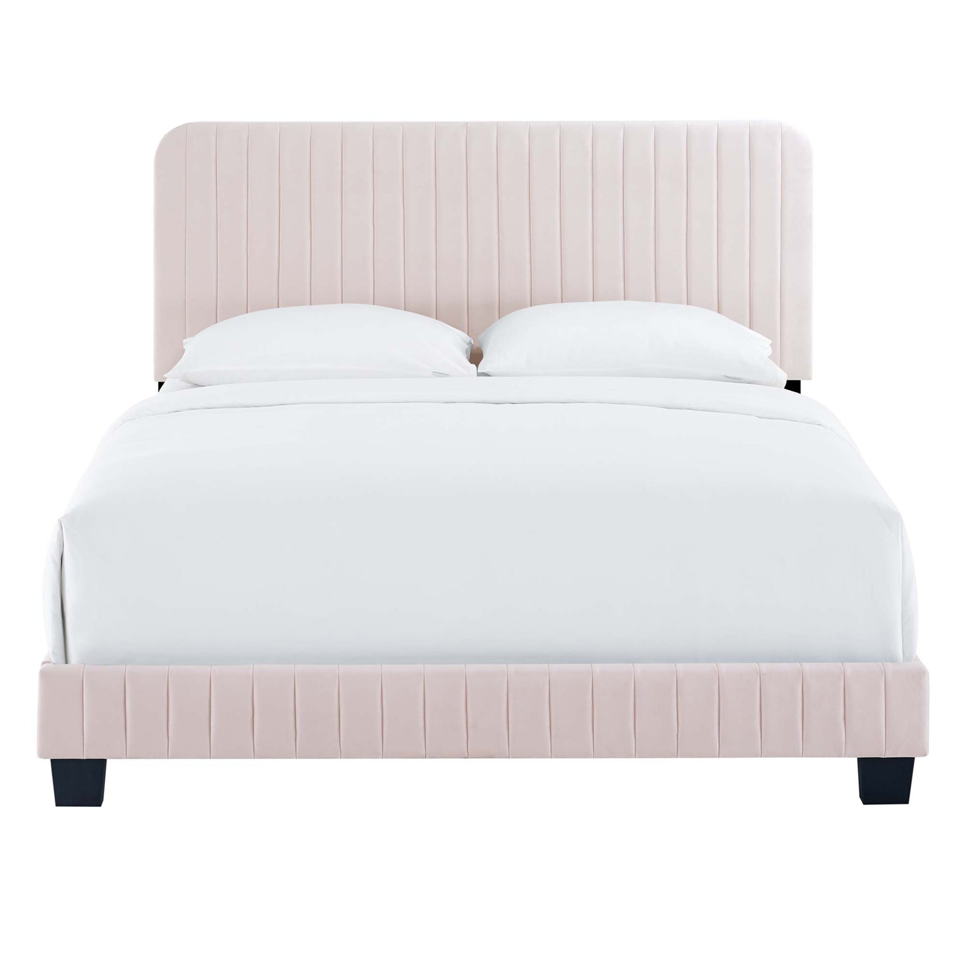 Soft red upholstered bed with vertical channel tufting on headboard & footboard, white bedding, black square legs.