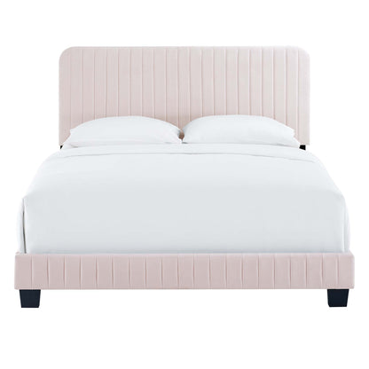 Soft red upholstered bed with vertical channel tufting on headboard & footboard, white bedding, black square legs.