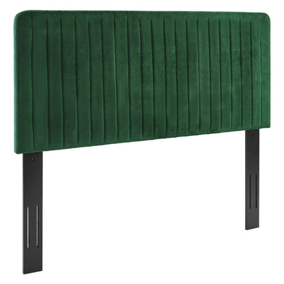 Green velvet upholstered headboard with vertical channel tufting and black metal legs.