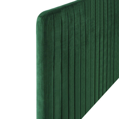 Emerald green velvet upholstered headboard with vertical channel tufting and curved top edge.