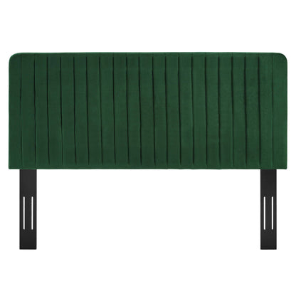 Green velvet tufted headboard panel with vertical channels and black metal legs for bed frame.